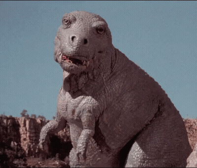 Dinosaur Looking At Camera With Mouth Open GIF