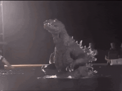 Dinosaur Statue In Dark Room With Basketball Player GIF