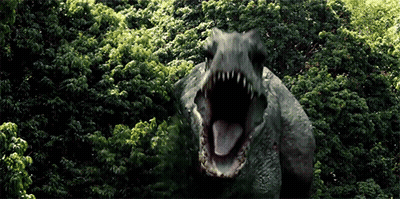 Dinosaur With Mouth Open In Woods GIF