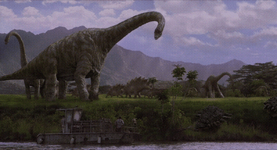 Dinosaurs Standing In Field Near River GIF