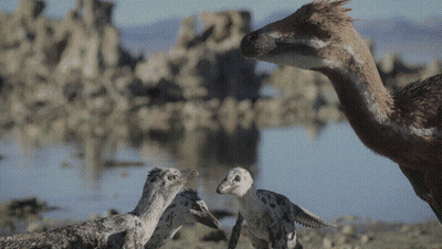 Dinosaurs Standing Near Water GIF
