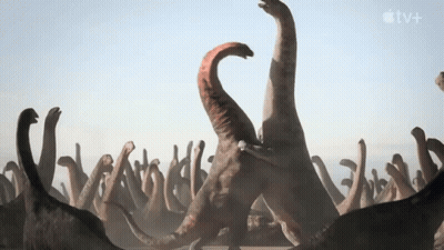 Dinosaurs Standing Next To Apple TV+ Logo GIF