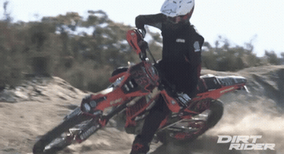 Dirt Rider Riding Motorcycle On Dirt Road GIF