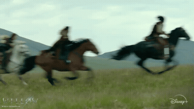 Disney Logo Group Riding Horses In Field GIF