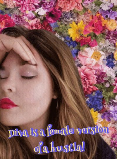 Diva Is A Female Version Of A Hustla With A Woman In Front Of Flowers GIF