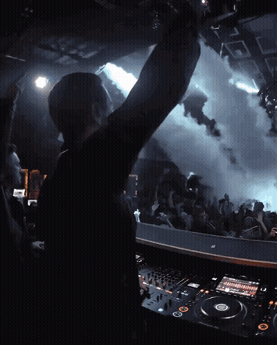 DJ Playing Music With Hand Up GIF