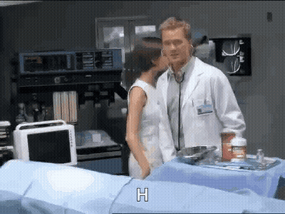Doctor And Woman Kissing In Hospital Room GIF