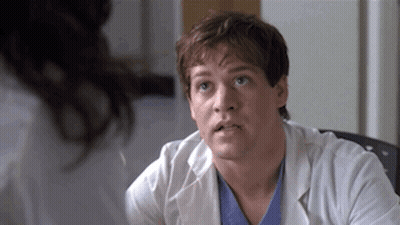 Doctor In Lab Coat Talking To Woman In Hospital GIF