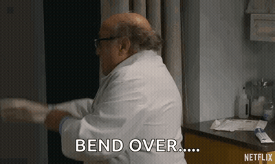 Doctor In White Coat Bending Patient's Arm GIF