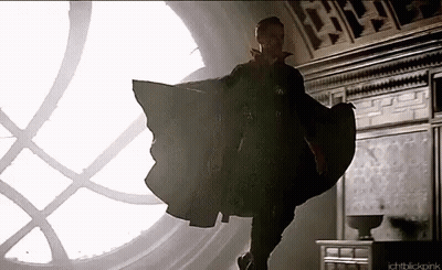 Doctor Strange Is Flying Through The Air In Front Of A Large Window . GIF