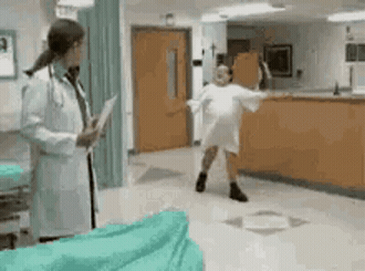 Doctor Talking To Dancing Patient In Hospital GIF