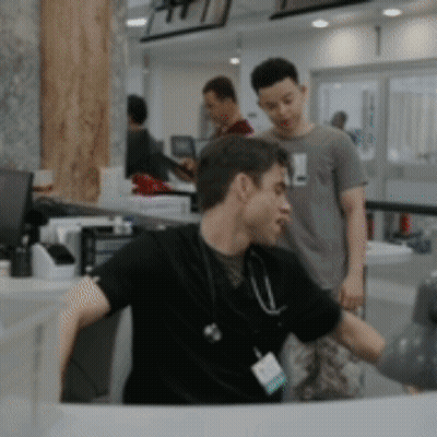 Doctor With Stethoscope Sitting At Desk GIF