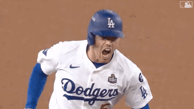 Dodgers Baseball Player In Blue Helmet And White Jersey GIF