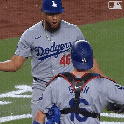 Dodgers Player High Fives Teammate In Front Of Win Sign GIF