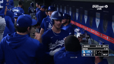 Dodgers Players Huddle In Dugout GIF