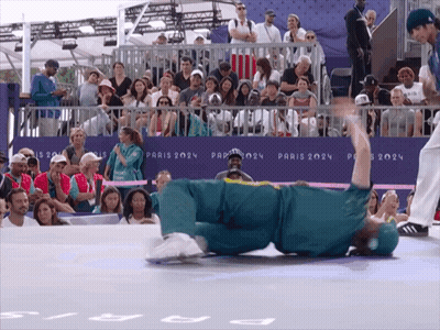 Dog Carrying Two Plastic Cups On A Stick GIF