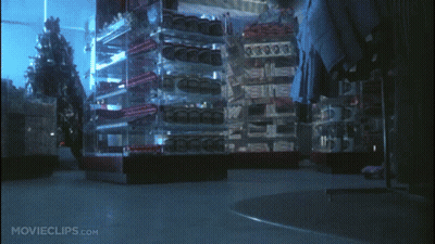 Dog In Front Of Christmas Tree With Survive Boxes GIF