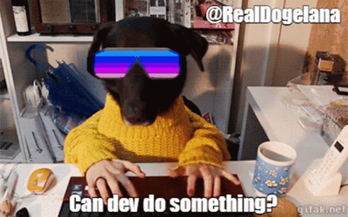 Dog In Sunglasses And Yellow Sweater Typing On Keyboard GIF