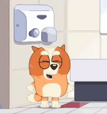 Dog Standing In Front Of Hand Dryer GIF