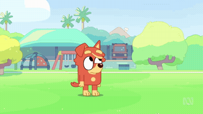 Dog Standing In Front Of Playground GIF