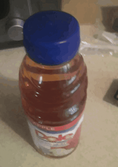 Dole Apple Juice Bottle With Blue Cap GIF