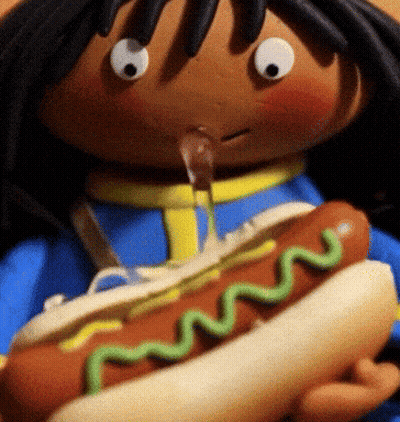 Doll Holding Hot Dog With Green Mustard GIF