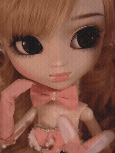 Doll In Pink Gloves And Pink Bow GIF