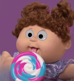 Doll Licking Lollipop Googly Eyes GIF
