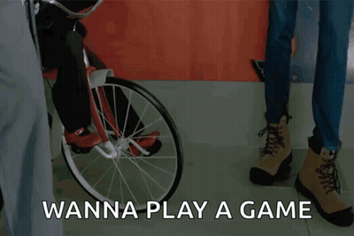 Doll On Tricycle Saying Wanna Play A Game GIF