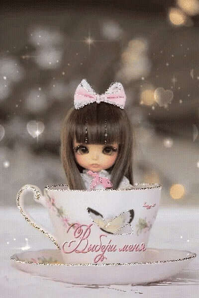Doll Sitting In Teacup Saying Dobry Mers GIF