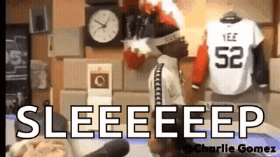 Doll Standing In Front Of Clock And Jersey Saying Seeeeep GIF