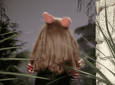 Doll With Long Hair And Pink Ears In Grass GIF