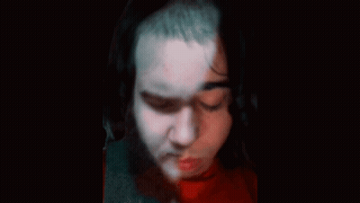 Doll With Pins On Face And Neck GIF