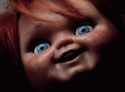 Doll With Red Hair And Blue Eyes Smiling GIF