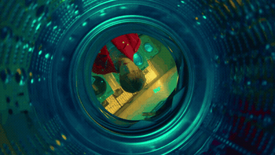 Dollar Bill Thrown Into Laundromat Machine GIF