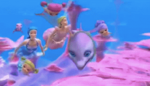 Dolls Swimming In Ocean With Dolphin GIF