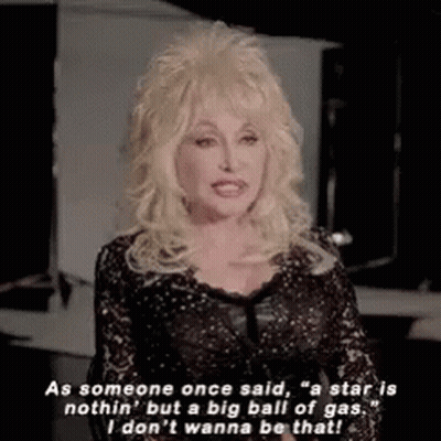 Dolly Parton Is Wearing A Black Lace Dress And Is Talking About A Star . GIF