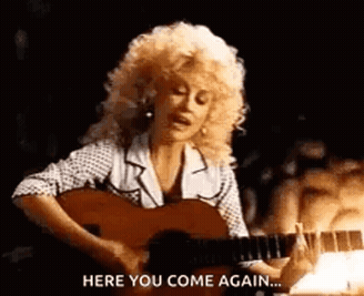 Dolly Parton Playing Guitar Saying Here You Come Again GIF