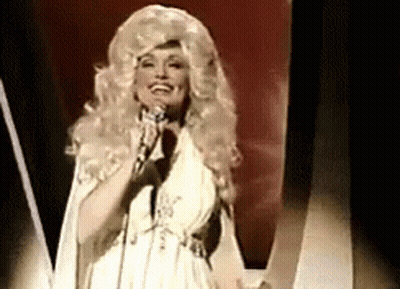 Dolly Parton Singing Into Microphone In White Dress GIF