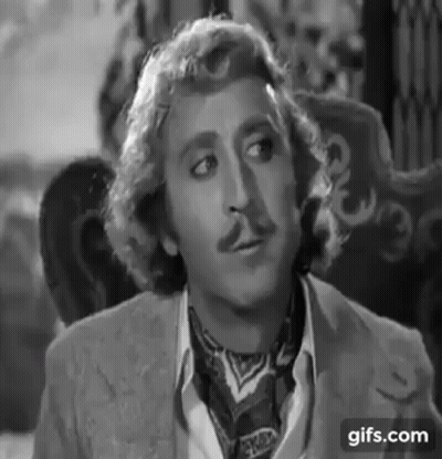 Dolly Parton Singing Into Microphone With Wig And Earrings GIF
