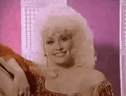 Dolly Parton Wink And Saying Hi GIF