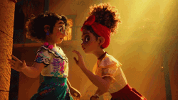 Dolores Madrigal Whispers To Mirabel GIF