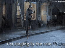 Don Lockwood Holding His Umbrella Dancing In The Rain GIF