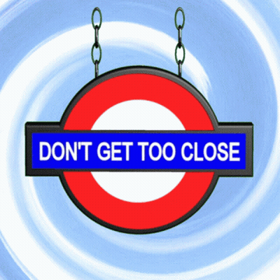 Don't Get Too Close Sign Hanging From Chains GIF