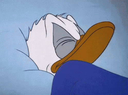 Donald Duck Laying On Bed With Head On Pillow GIF