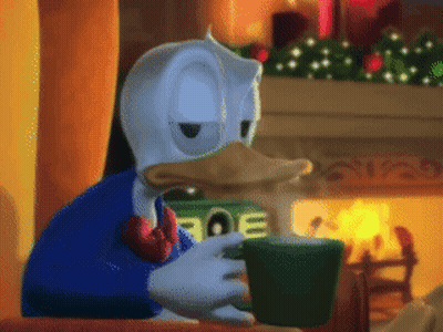 Donald Duck Sitting By Fireplace Drinking From Green Cup GIF