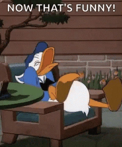 Donald Duck Sitting In Chair With Legs Crossed GIF