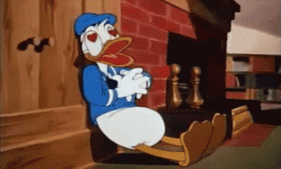 Donald Duck Sitting In Front Of Fireplace GIF