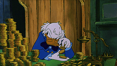 Donald Duck Sitting In Front Of Gold Coins GIF