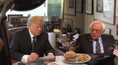 Donald Trump And Bernie Sanders Sitting At Desk With Plate Of Food GIF